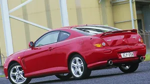 Sleek Hyundai Tiburon In Motion Wallpaper