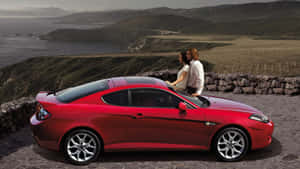 Sleek Hyundai Tiburon On The Road Wallpaper