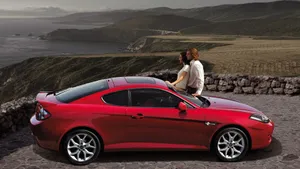 Sleek Hyundai Tiburon On The Road Wallpaper