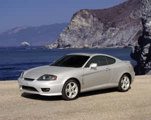 Sleek Hyundai Tiburon On The Road Wallpaper