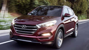 Sleek Hyundai Tucson In A Scenic Landscape Wallpaper