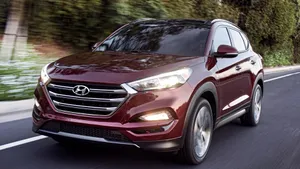 Sleek Hyundai Tucson In A Scenic Landscape Wallpaper