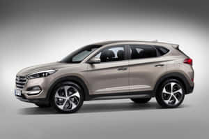 Sleek Hyundai Tucson In Natural Setting Wallpaper