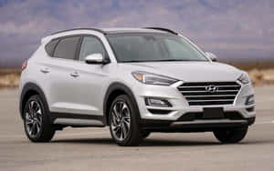 Sleek Hyundai Tucson On A Scenic Drive Wallpaper