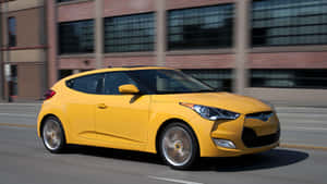 Sleek Hyundai Veloster Cruising The City Streets Wallpaper