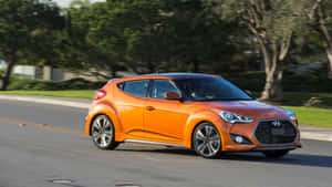 Sleek Hyundai Veloster In A Scenic Cityscape Wallpaper