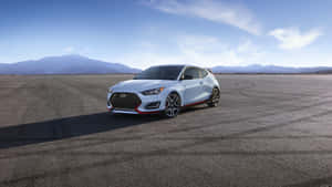 Sleek Hyundai Veloster On Open Road Wallpaper