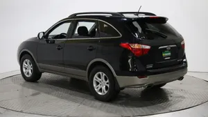 Sleek Hyundai Veracruz Driving On An Open Road Wallpaper