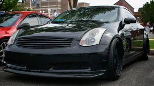 Sleek Infiniti G35 Coupe In Action Wallpaper