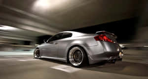 Sleek Infiniti G35 Cruising On The Open Road Wallpaper