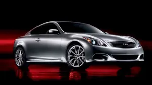 Sleek Infiniti G37 Gliding On The Highway Wallpaper