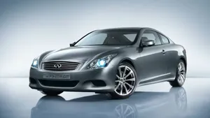 Sleek Infiniti G37 Gliding On The Open Road Wallpaper