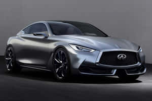 Sleek Infiniti Q60 Cruising Down A Winding Road Wallpaper