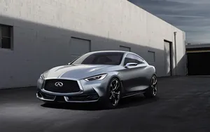 Sleek Infiniti Q60 Gliding On The Open Road. Wallpaper