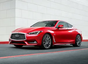 Sleek Infiniti Q60 Sports Coupe In Action Wallpaper