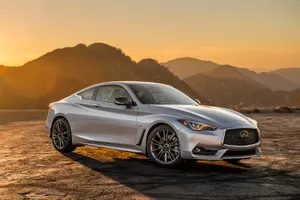 Sleek Infiniti Q60 Sports Coupe On Open Road Wallpaper