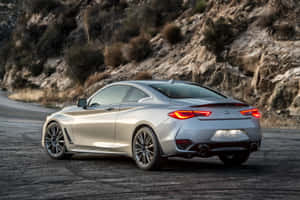 Sleek Infiniti Q60 Sports Coupe On The Road Wallpaper