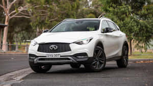 Sleek Infiniti Qx30 On A Scenic Route Wallpaper