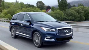 Sleek Infiniti Qx60 Gliding Effortlessly On An Open Road Wallpaper