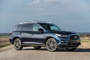 Sleek Infiniti Qx60 In Motion Wallpaper