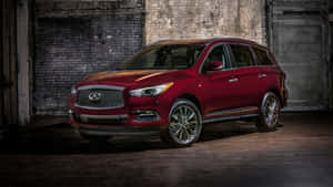 Sleek Infiniti Qx60 On A Scenic Route Wallpaper