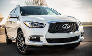 Sleek Infiniti Qx60 On The Road Wallpaper