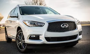 Sleek Infiniti Qx60 On The Road Wallpaper