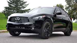 Sleek Infiniti Qx70 Gliding On Highway Wallpaper