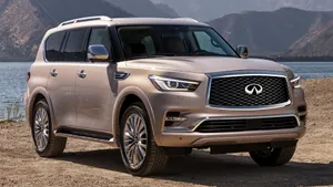 Sleek Infiniti Qx80 Suv Dominating The Road Wallpaper