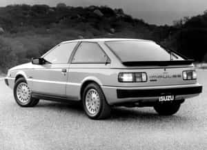 Sleek Isuzu Impulse In Urban Setting Wallpaper