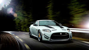 Sleek Jaguar Xkr In Action Wallpaper