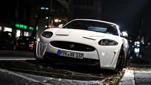 Sleek Jaguar Xkr In Action Wallpaper