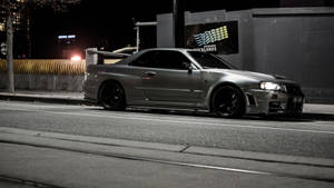 Sleek Jdm Car Cruises Sidewalk Wallpaper