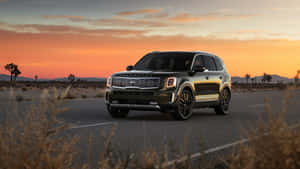 Sleek Kia Telluride Suv On A Scenic Drive Wallpaper