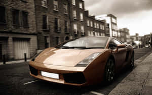 Sleek Lamborghini Gallardo Speeding Down The Highway Wallpaper