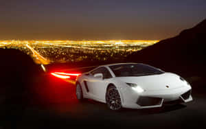 Sleek Lamborghini Gallardo Speeding On The Open Road Wallpaper