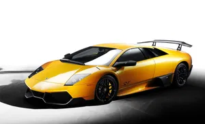 Sleek Lamborghini Murcielago Cruising On An Open Road Wallpaper