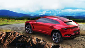 Sleek Lamborghini Urus Luxury Suv In Action Wallpaper