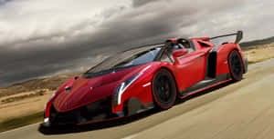 Sleek Lamborghini Veneno In Motion Wallpaper