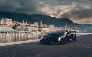 Sleek Lamborghini Veneno Racing On The Track Wallpaper