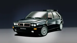 Sleek Lancia Car In Urban Environment Wallpaper