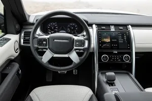 Sleek Land Rover Discovery Cruising On Highways Wallpaper