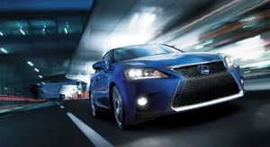 Sleek Lexus Ct 200h Hybrid Driving Through The City Wallpaper