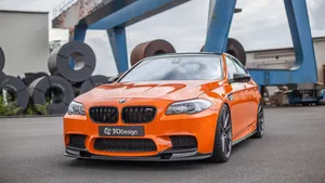 Sleek, Luxury And Power - Bmw M5 On The Road Wallpaper