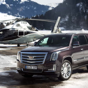 Sleek Luxury Cadillac Escalade On The Open Road Wallpaper