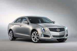 Sleek Luxury Cadillac Xts On Open Road Wallpaper