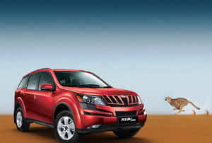 Sleek Mahindra Xuv500 In Motion Wallpaper