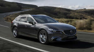 Sleek Mazda 6 In Motion Wallpaper