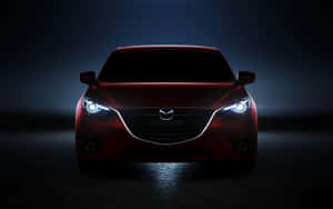 Sleek Mazda 6 In Vibrant Red On Open Road Wallpaper