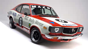 Sleek Mazda Rx-3 In Action Wallpaper